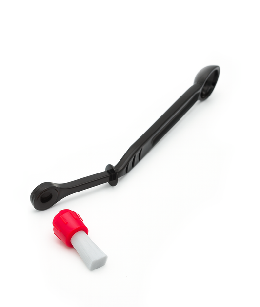 Group cleaning brush with integrated cleaning dozer